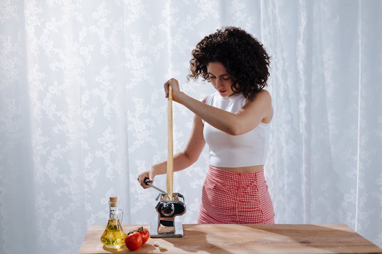 Portrait Of Woman Making Pasta