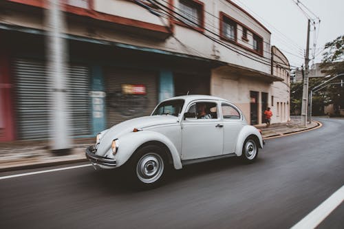 White Volkswagen Beetle on Road