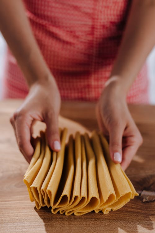 Free A Female Hands Holding Pasta Dough Stock Photo