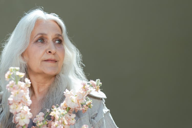 Close Up Photo Of Elderly Woman Looking Away