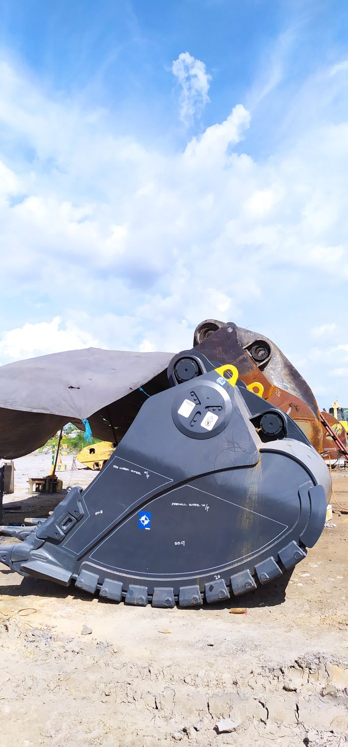 Excavator bucket on rock