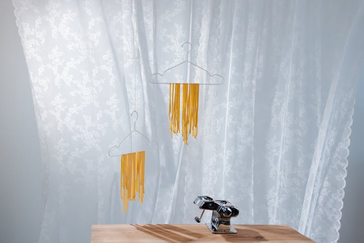 Pasta Drying On Clothing Hangers 