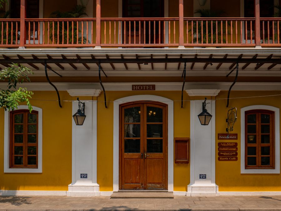 Colonial hotel facade in Puducherry with vibrant colours