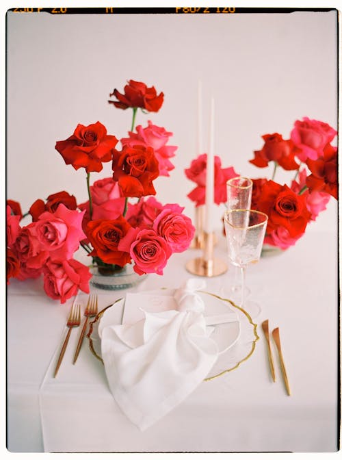 Photograph of Red Flowers round Dish with Napkin