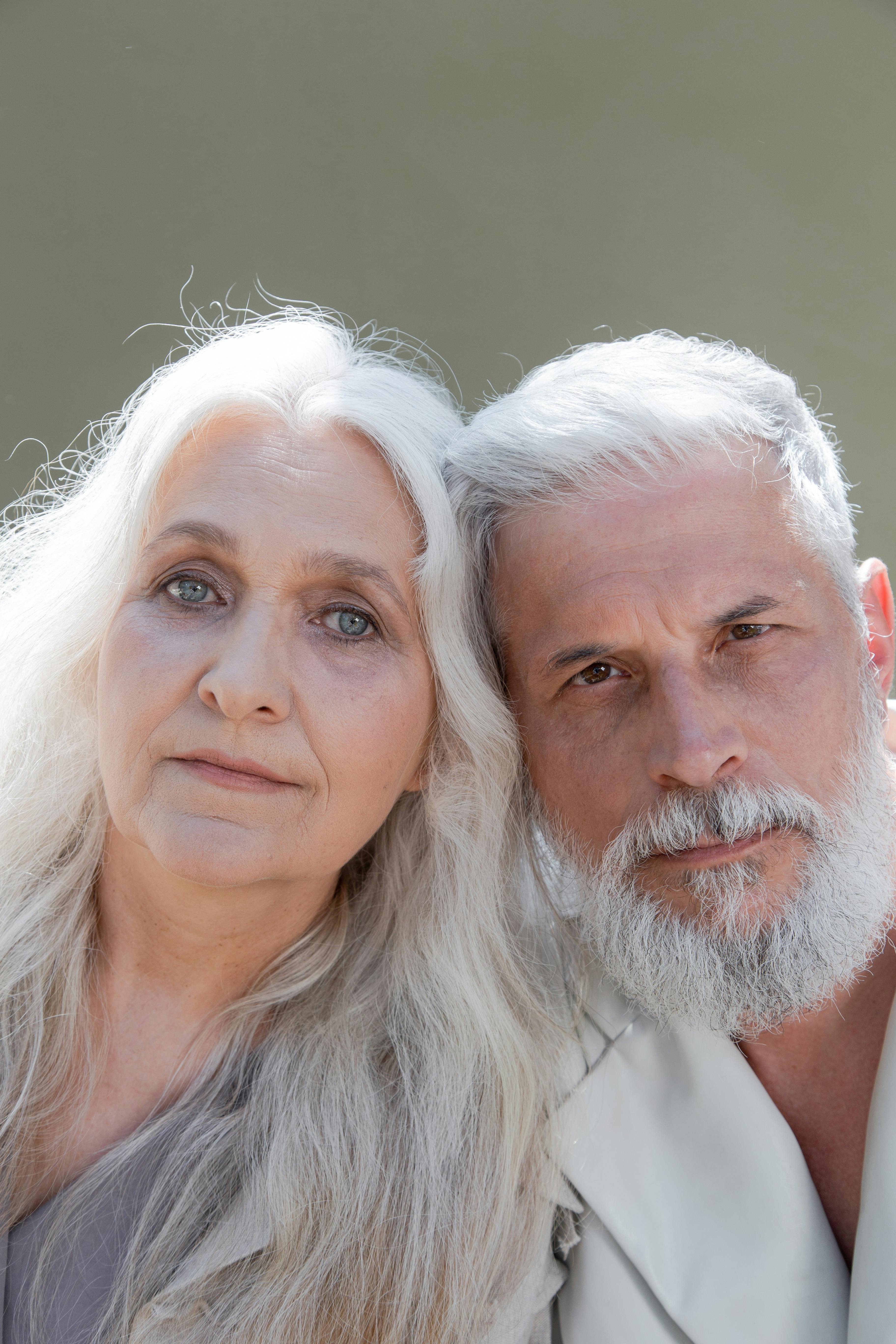 close up photo of an elderly couple with gray hair