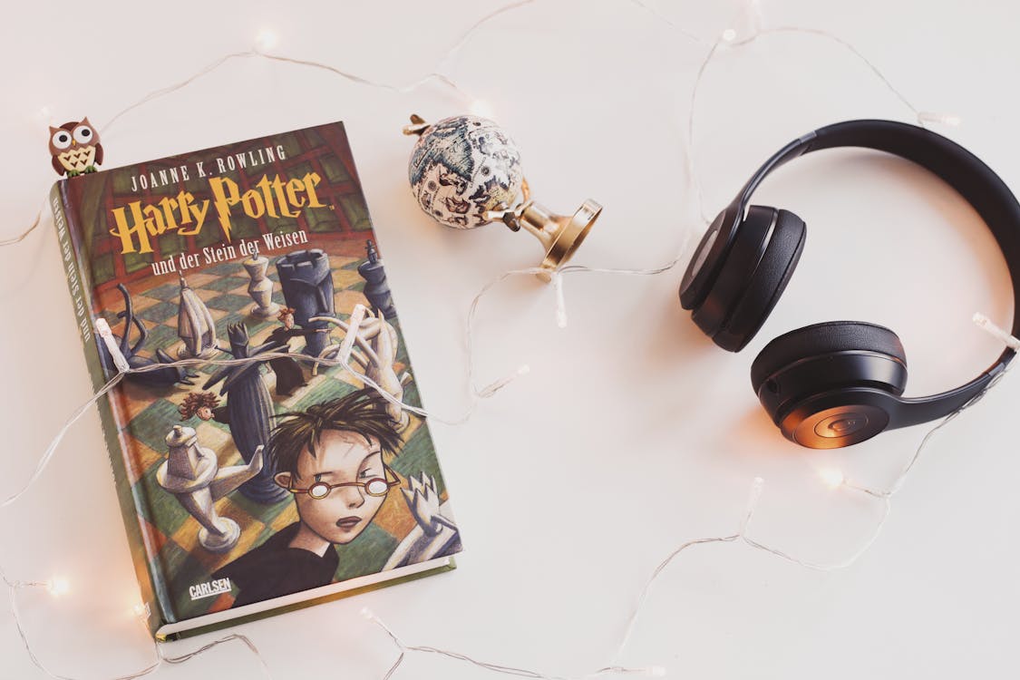 Free Harry Potter Book and Black Headphones With Trinket Stock Photo
