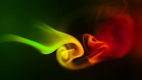 A Glowing Colorful Wave of Smoke in Black Background
