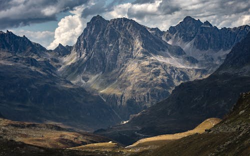 Aerial Photography of Mountains under the Cloudy Sky