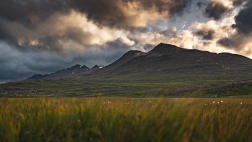 Free Scenic view of Icelandic mountains under dramatic skies, perfect for nature and travel themes. Stock Photo