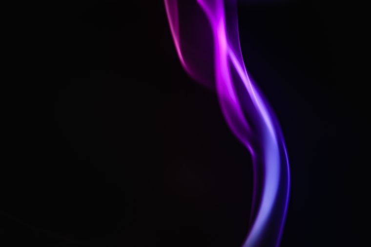 Abstract purple smoke on a black background — photo by Marek Piwnicki on Pexels