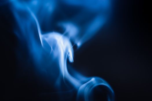 A Blue and White Smoke in Close-Up Photography