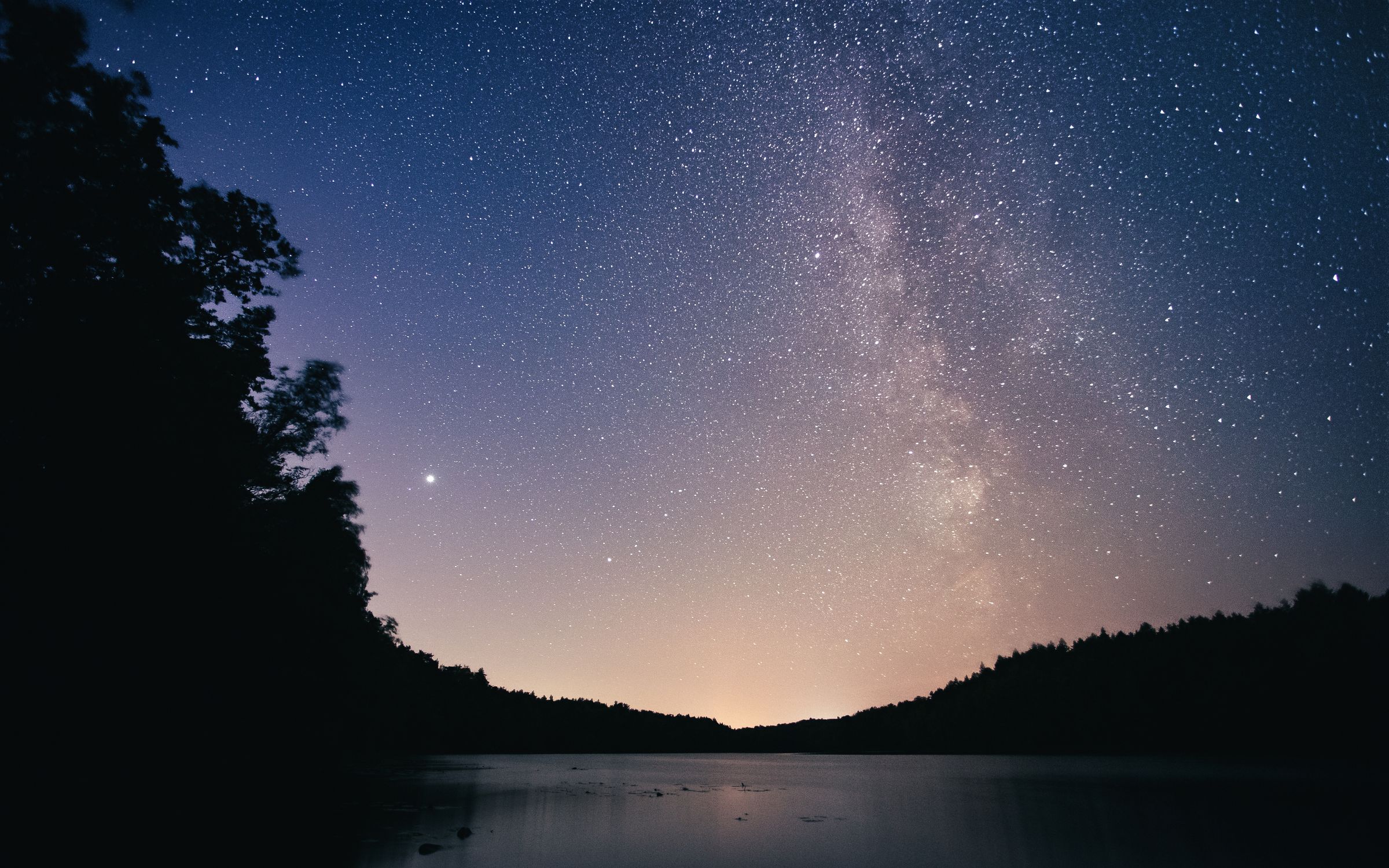 Silhouette of Trees Beside lake Under a Starry Sky · Free Stock Photo