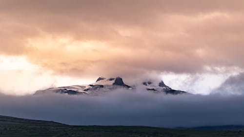 Rocky Mountain Covered with White Clouds