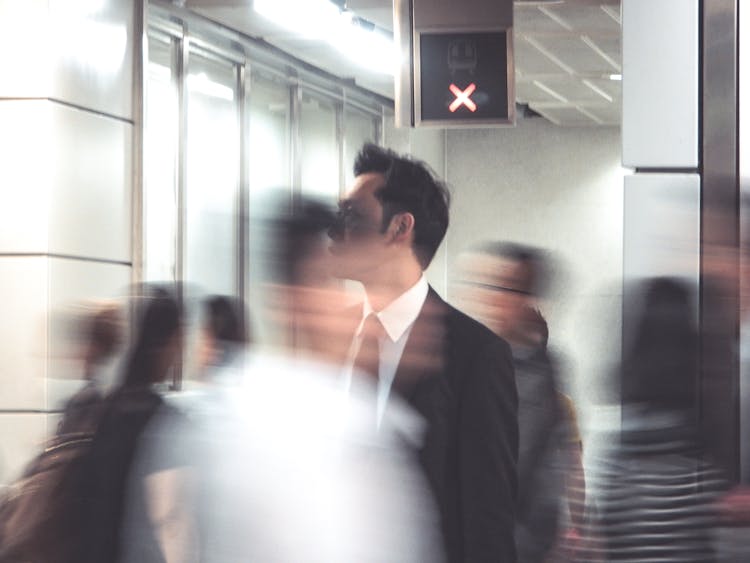 Man In Suit Among People