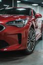 Photograph of a Red Car's Headlight