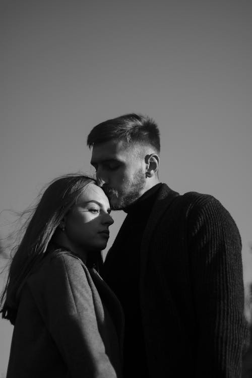 Free Black and White Photograph of a Man Kissing a Woman Stock Photo