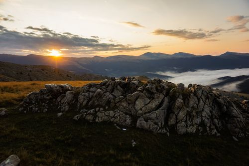 Free Breathtaking sunrise over a mountainous landscape with a sea of clouds. Stock Photo