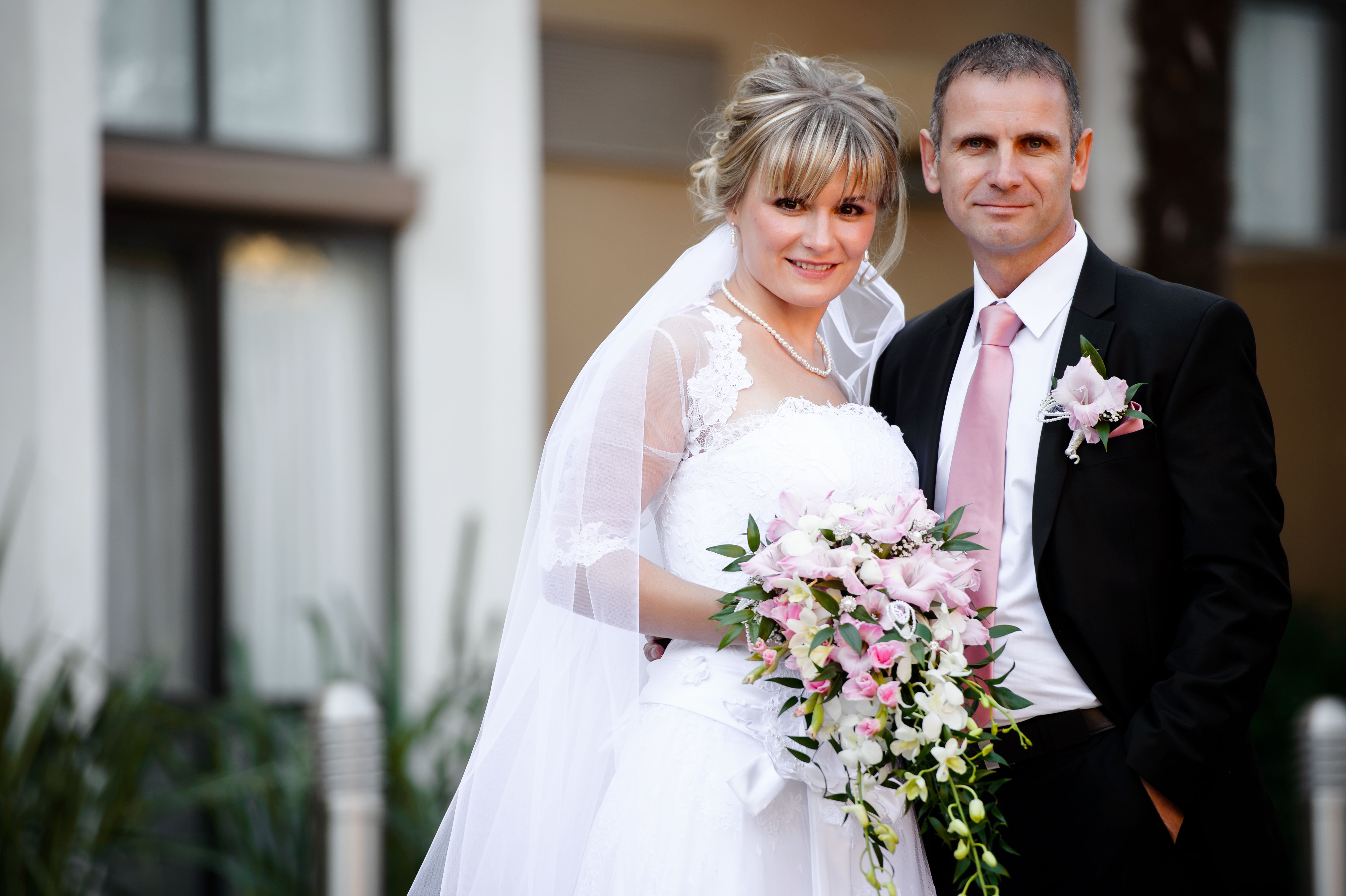 Woman in White Wedding Gown Holding Bouquet of Flowers · Free Stock Photo