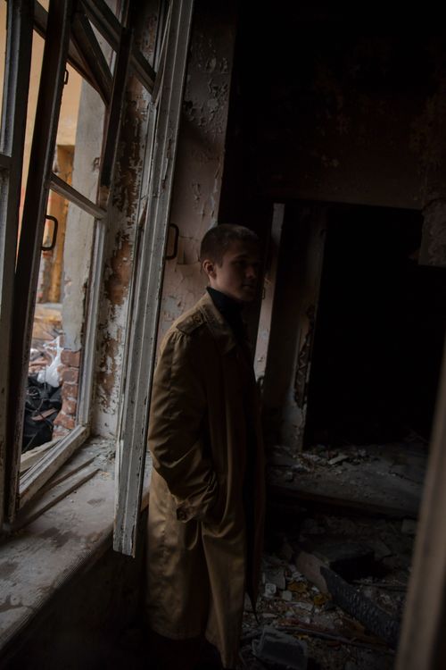 Free Silhouette of a man in an abandoned building, capturing a moody and eerie atmosphere. Stock Photo