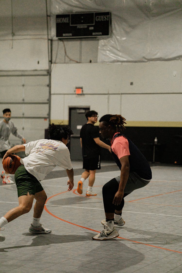 Photo Of Men Playing Basketball