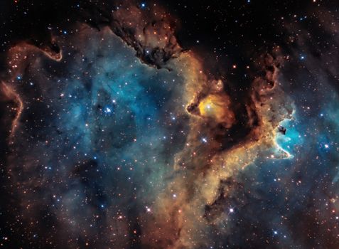 Colorful nebula and star field showcasing the vastness of deep space with vivid colors and celestial formations.