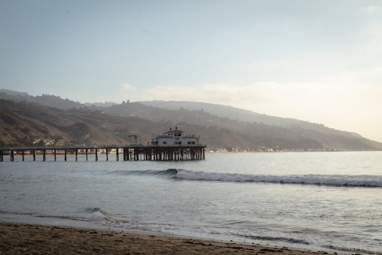 Building At End Of Pier By Sea Shore