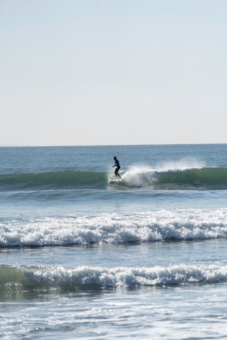 Silhouette Of A Person Surfing