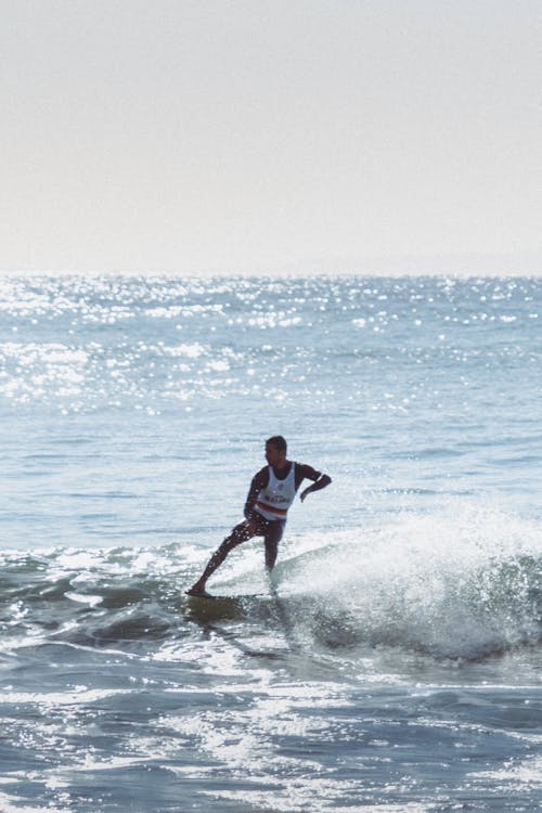 Photograph of a Man Surfing