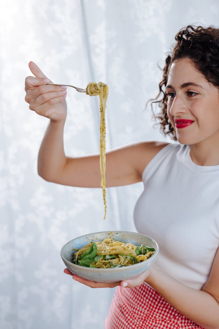 Woman Eating Pasta