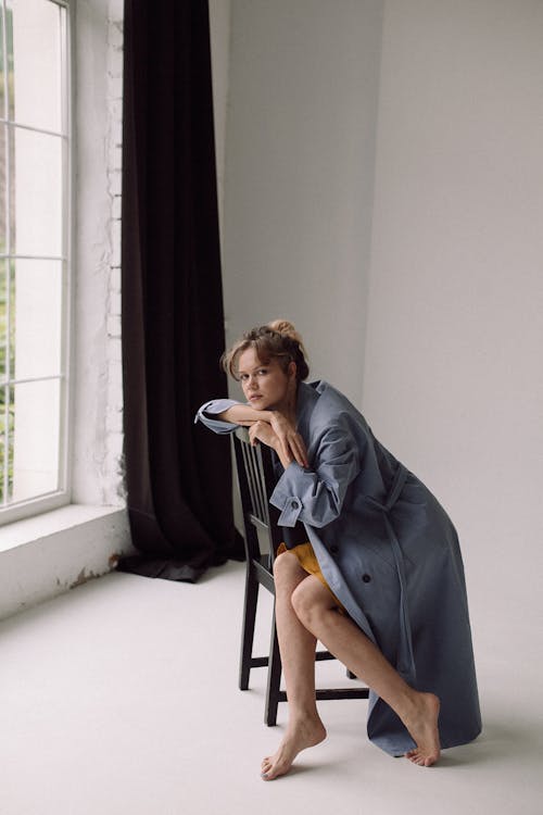 Young Woman Sitting in Studio 