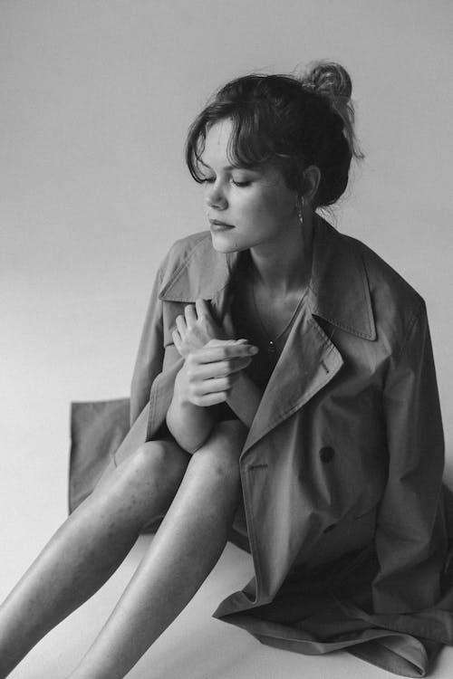 Studio Shot of Young Woman in Coat 