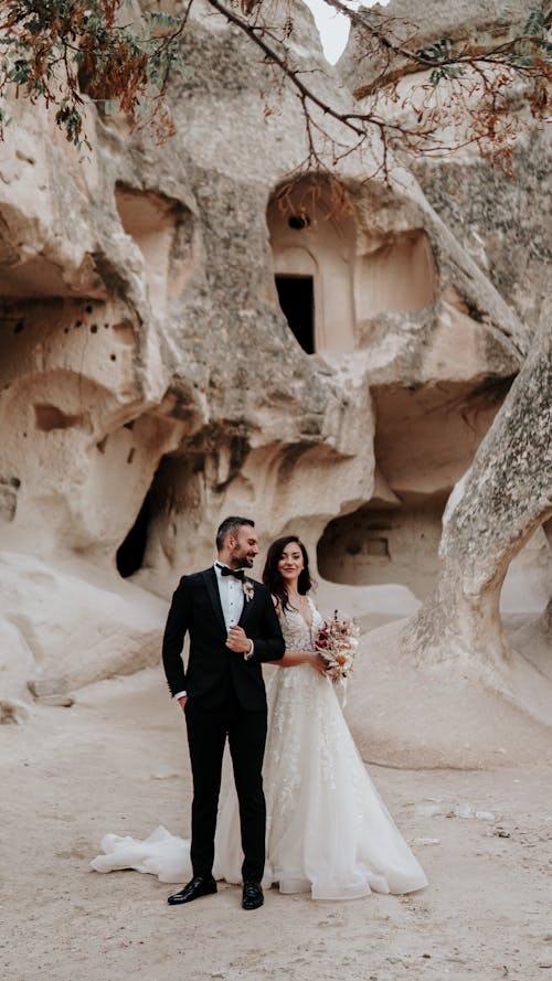 A Couple Standing Near the Rock Formations