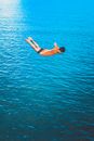 A Man Diving at the Beach