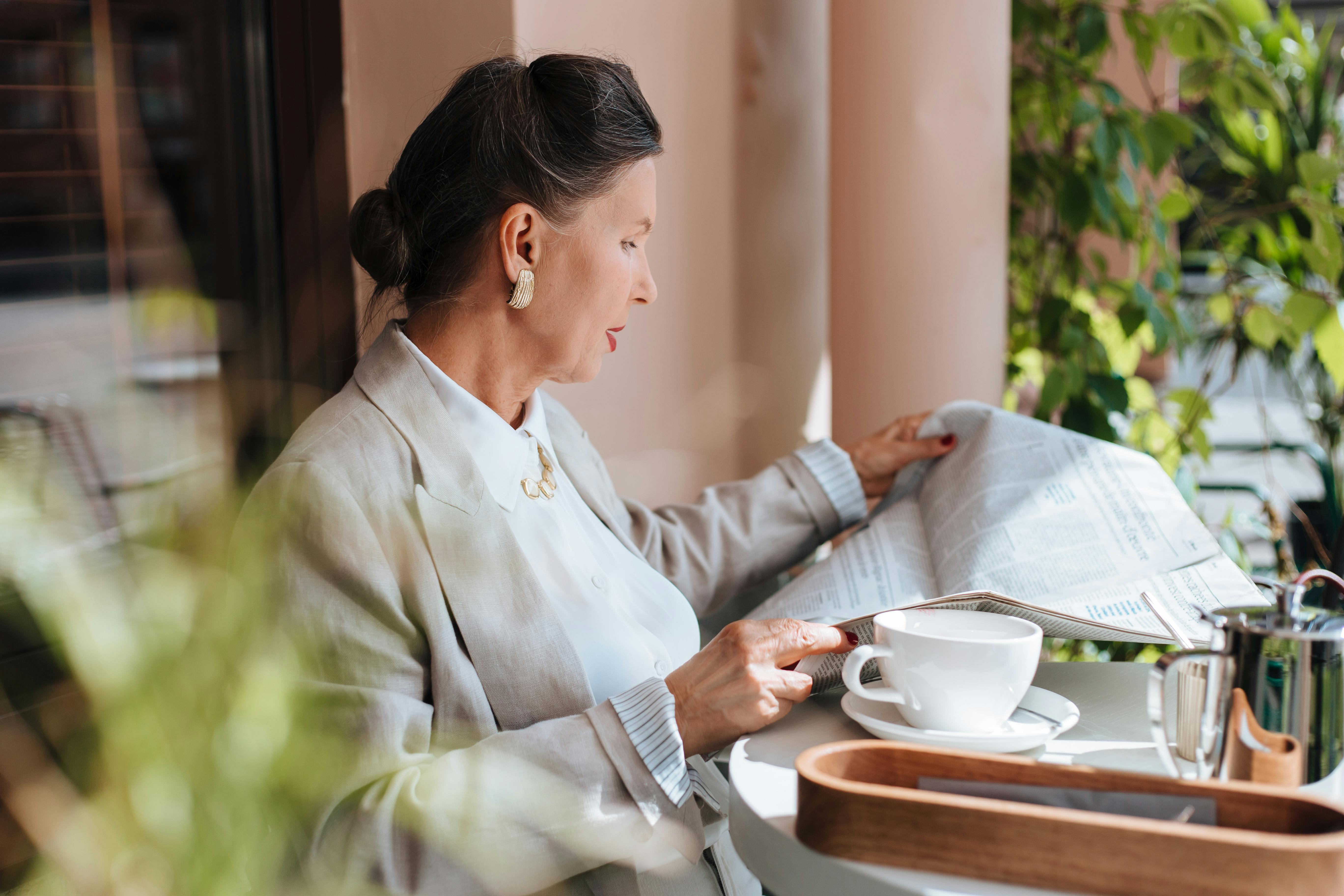 a woman reading a newspaper