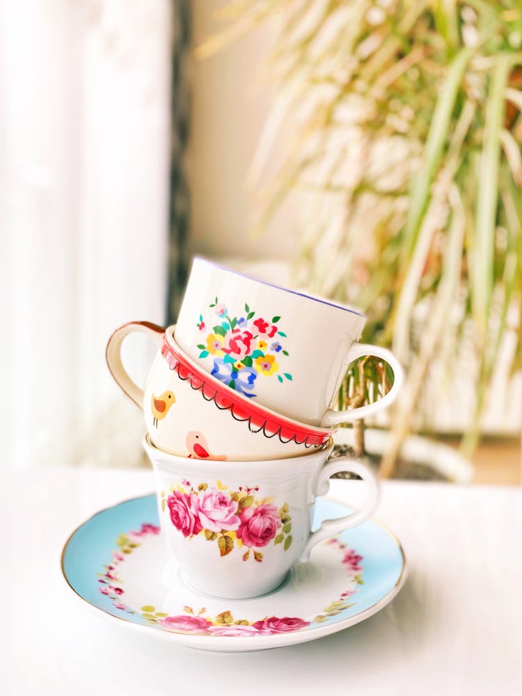 A Stack Of Ceramic Cups On A Saucer