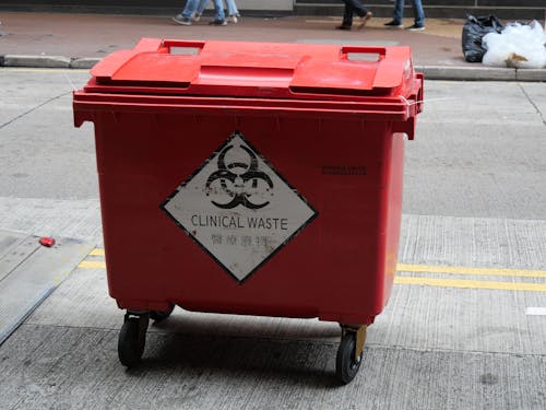 Free Wheeled Trash Bin on the Street Stock Photo