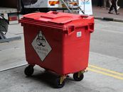 A Red Plastic Garbage Bin for Clinical Waste