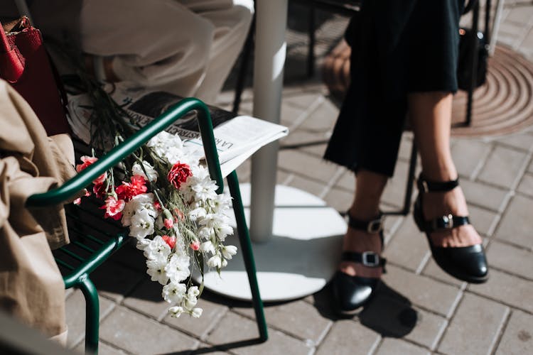 Flowers Over A Metal Chair