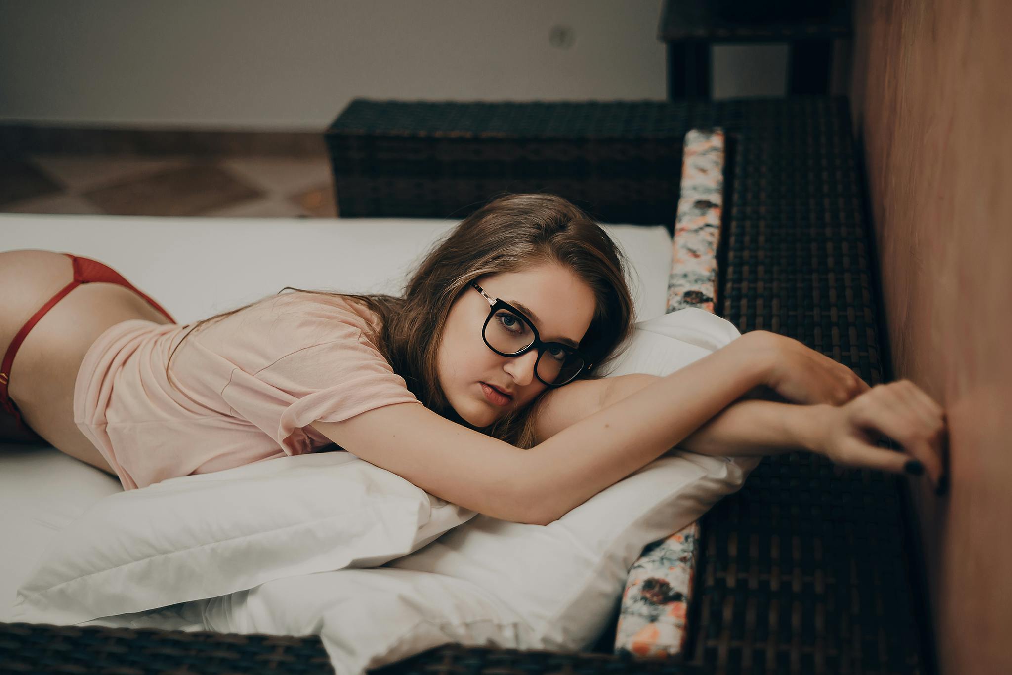 woman lying in beige crew neck shirt