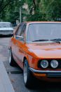 Orange Car Parked on Parking Lot