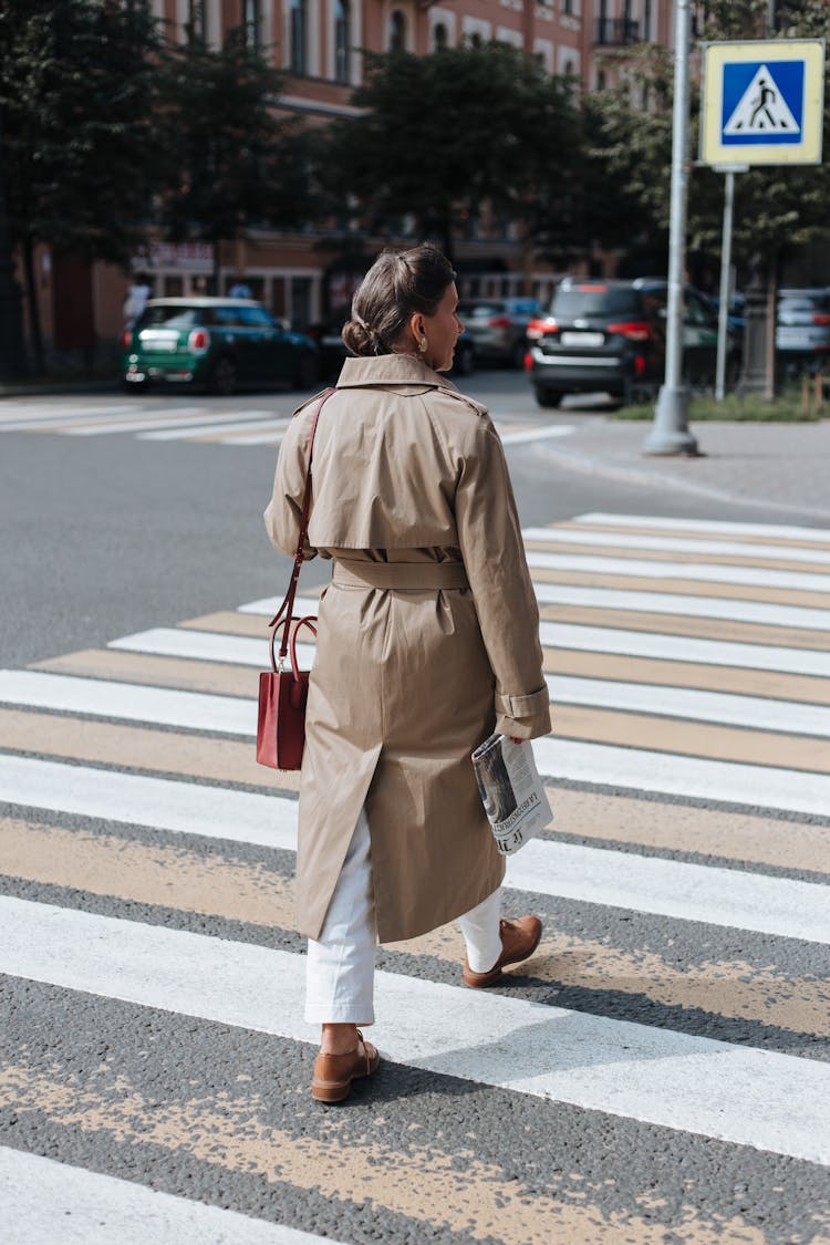 An Elderly Woman Crossing The Street