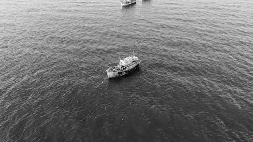 An Aerial Photography of a Fishing Boat Docked in the Middle of the Sea