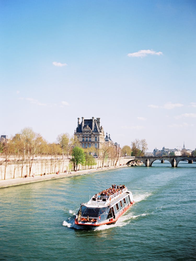 Passengers On A Bateaux Mouches Traveling The Seine River