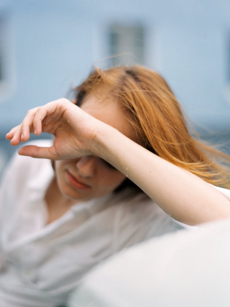 A Woman Covering Her Face