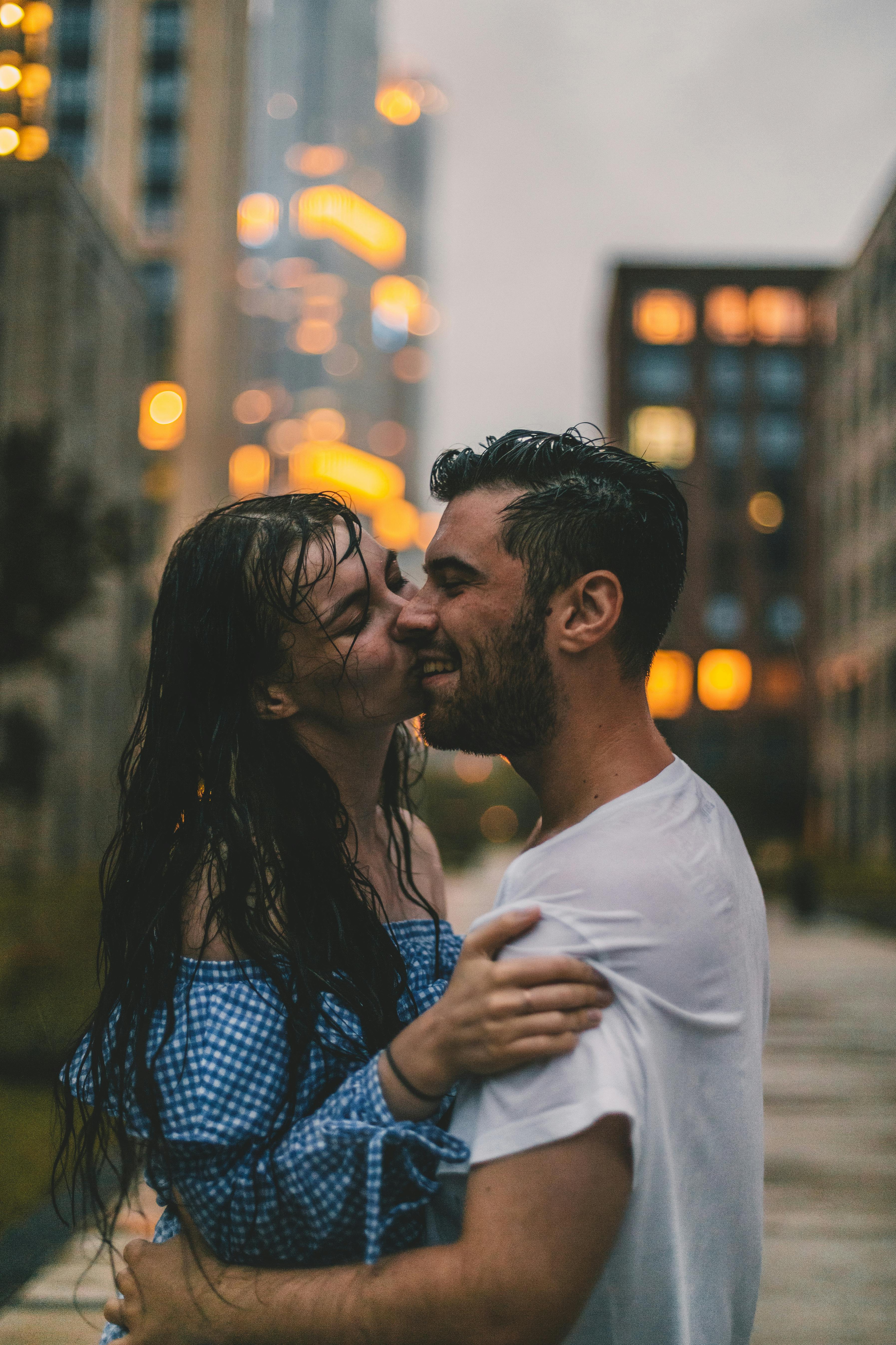 couple kissing in rain