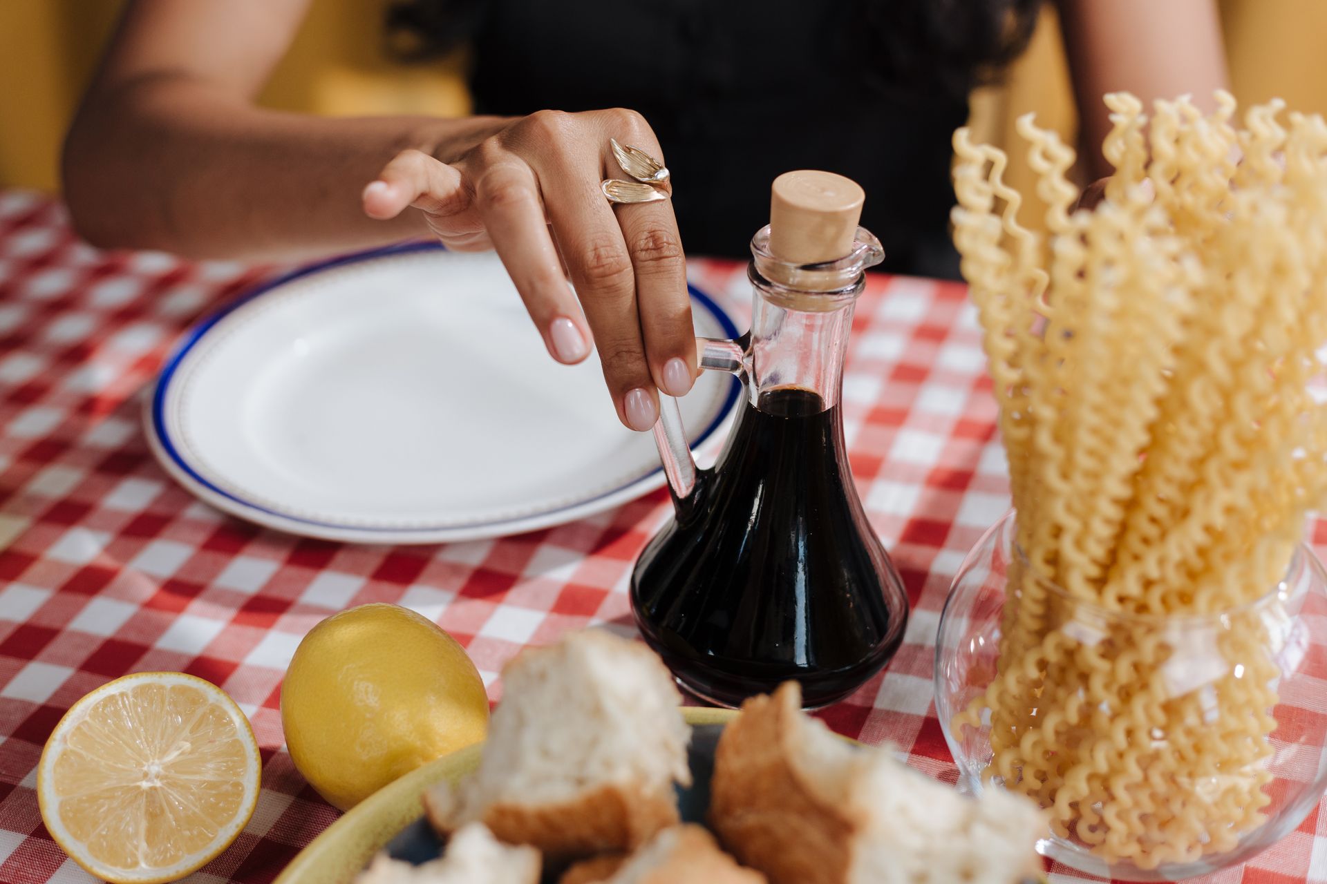 Close up on Woman Taking Vinegar Bottle