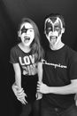 A Man and a Girl with Punk Style Face Paint