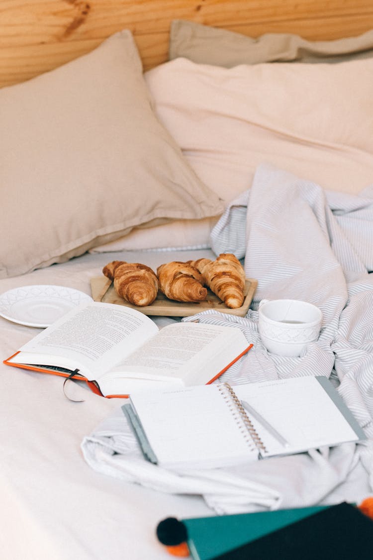 Photo Of Croissants Near A Book