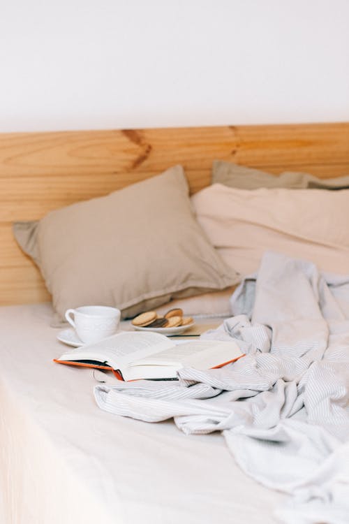 Free Photo of Cookies and a Book on a Bed Stock Photo
