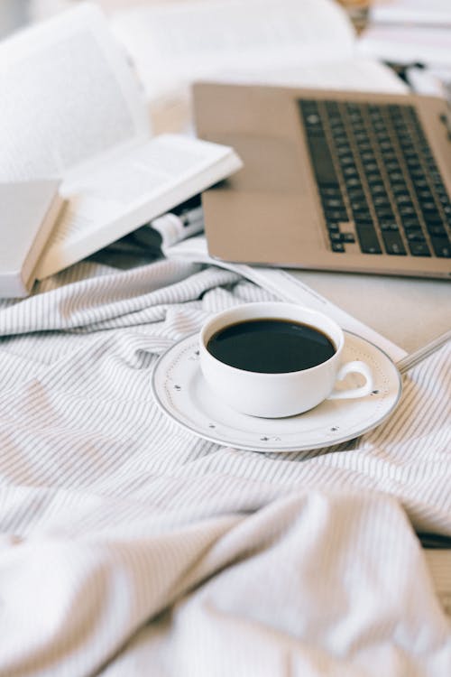 Free A Cup of Black Coffee on the Bed Stock Photo